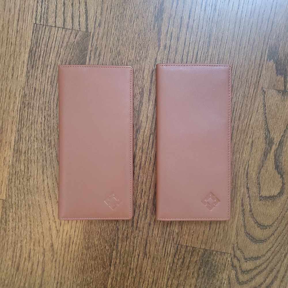 Set of tan leather passport holders